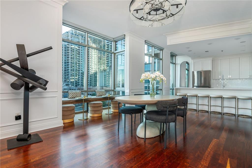905 Juniper Street Northeast, Unit 705 Atlanta, GA 30309 - Photo 20 of 62 a view of a dining room with furniture window and wooden floor