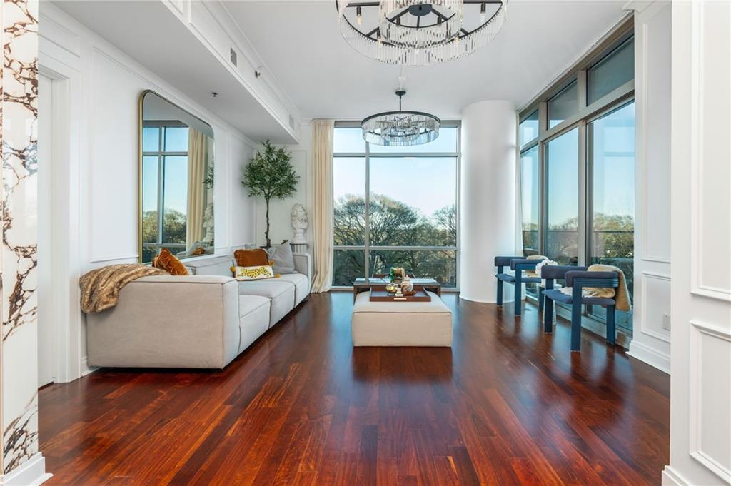 905 Juniper Street Northeast, Unit 705 Atlanta, GA 30309 - Photo 22 of 62 a living room with furniture and a large window