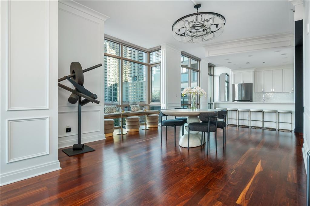 905 Juniper Street Northeast, Unit 705 Atlanta, GA 30309 - Photo 29 of 62 a view of a dining room with furniture window and wooden floor