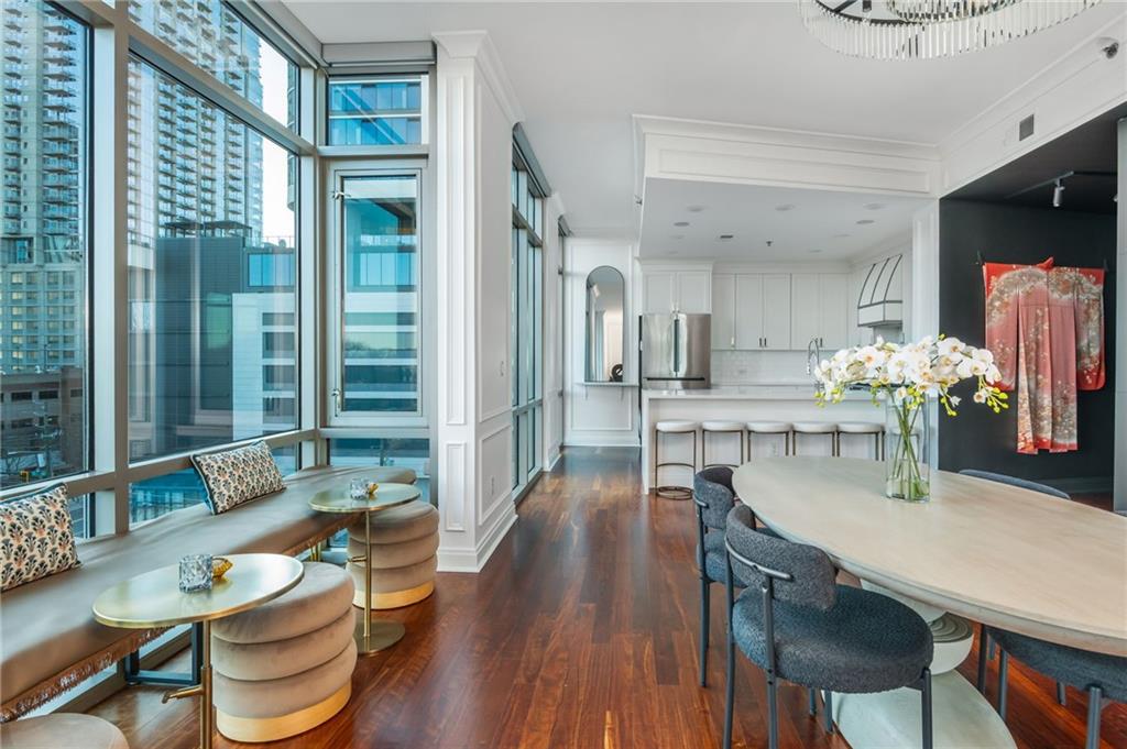 905 Juniper Street Northeast, Unit 705 Atlanta, GA 30309 - Photo 31 of 62 a dining room with furniture and wooden floor