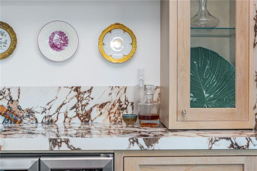 905 Juniper Street Northeast, Unit 705 Atlanta, GA 30309 - Photo 35 of 62 a view of a entryway with paintings and wooden floor