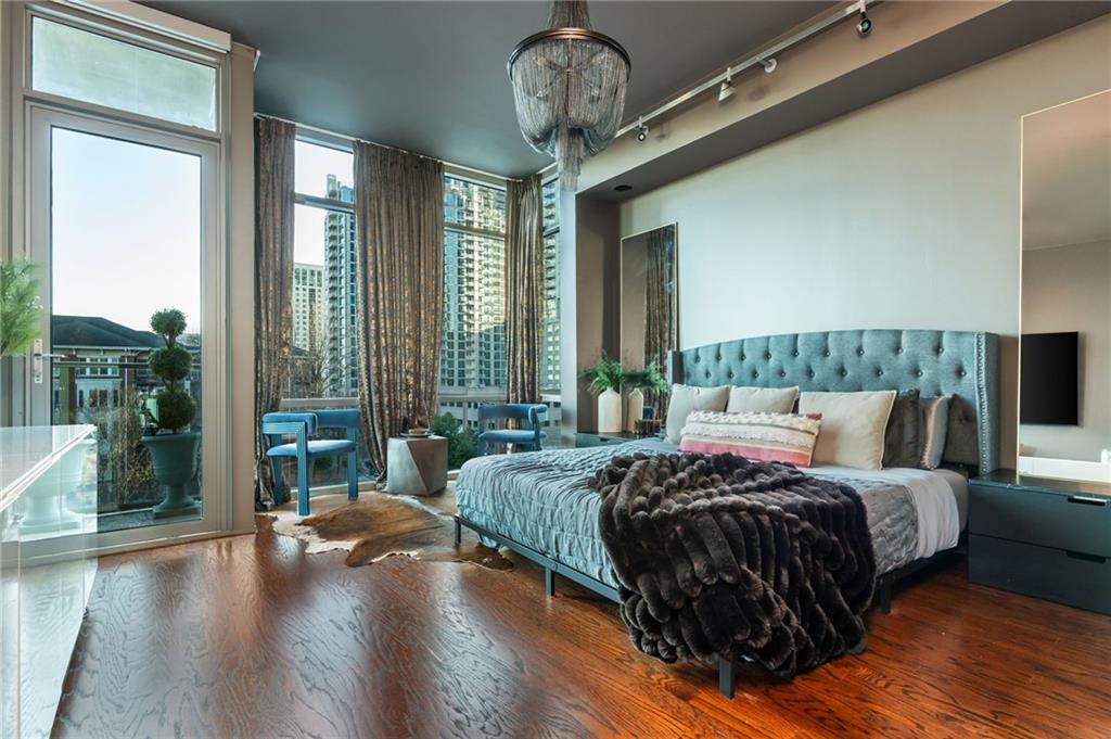 905 Juniper Street Northeast, Unit 705 Atlanta, GA 30309 - Photo 37 of 62 a bedroom with bed and a large window