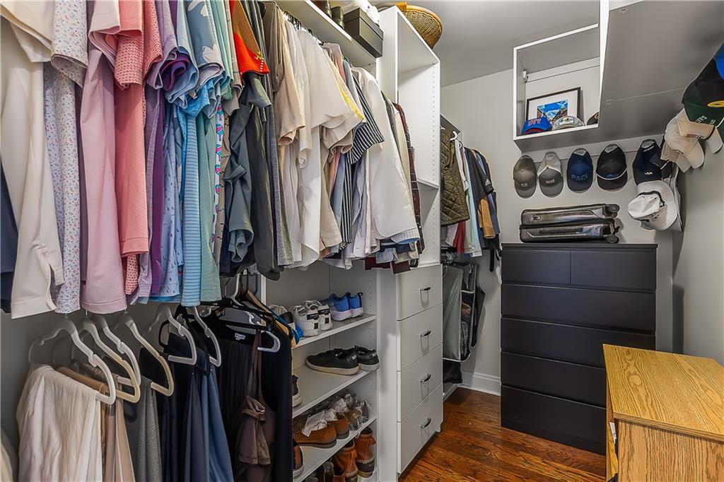 905 Juniper Street Northeast, Unit 705 Atlanta, GA 30309 - Photo 40 of 62 a view of walk in closet with clothes and shoes