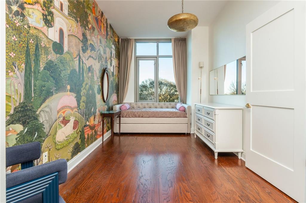 905 Juniper Street Northeast, Unit 705 Atlanta, GA 30309 - Photo 49 of 62 a living room with furniture and a table