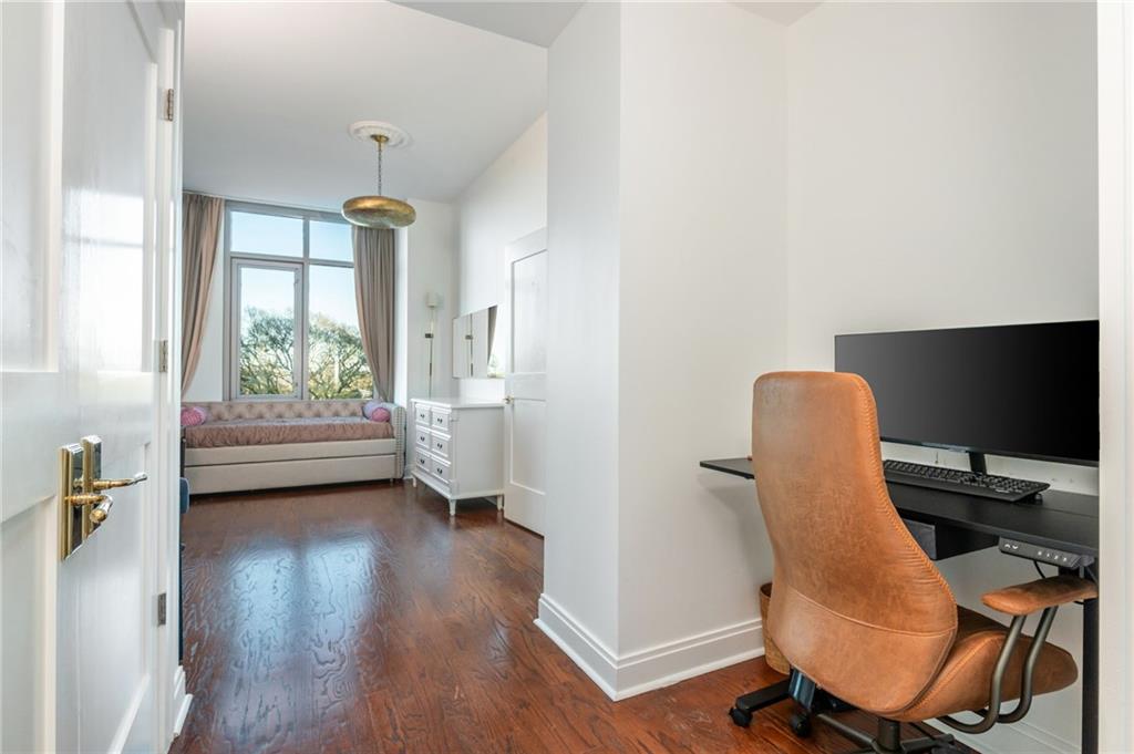 905 Juniper Street Northeast, Unit 705 Atlanta, GA 30309 - Photo 52 of 62 a view of a workspace with furniture and a window