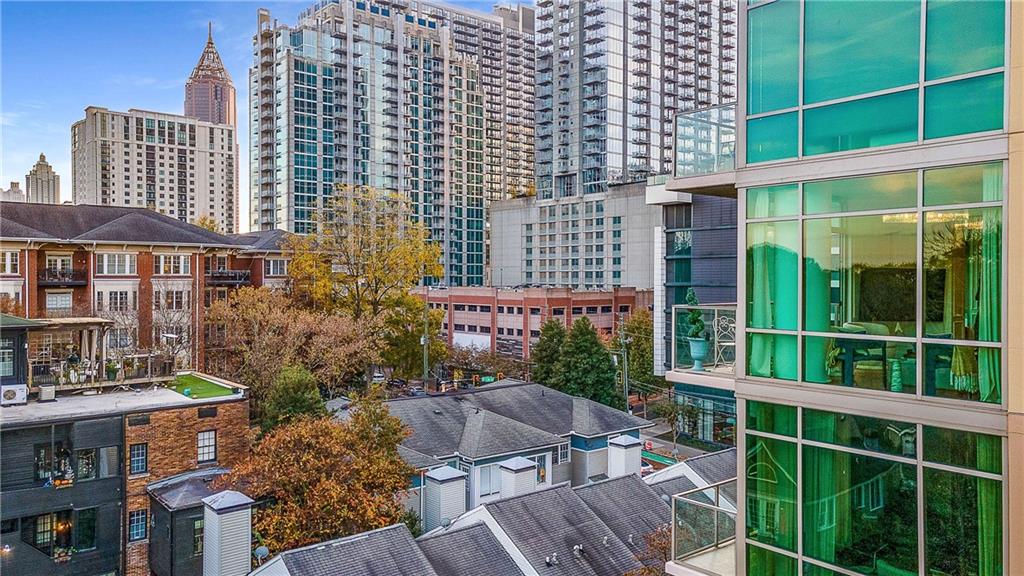 905 Juniper Street Northeast, Unit 705 Atlanta, GA 30309 - Photo 61 of 62 a view of building with an outdoor space