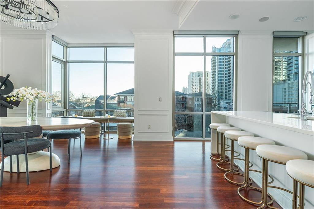 905 Juniper Street Northeast, Unit 705 Atlanta, GA 30309 - Photo 8 of 62 a living room with furniture and a large window