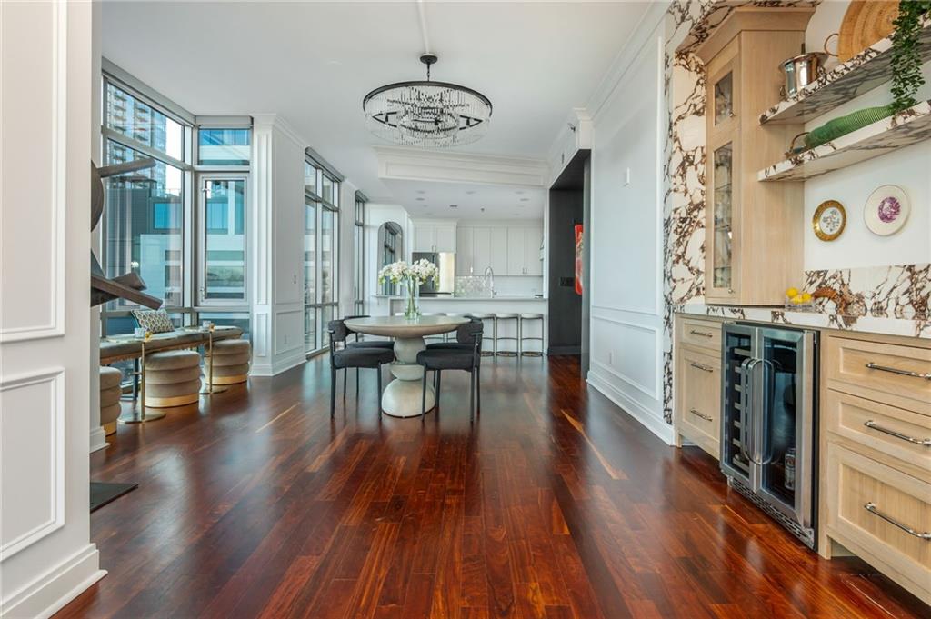 905 Juniper Street Northeast, Unit 705 Atlanta, GA 30309 - Photo 10 of 62 a view of a dining room with furniture and wooden floor