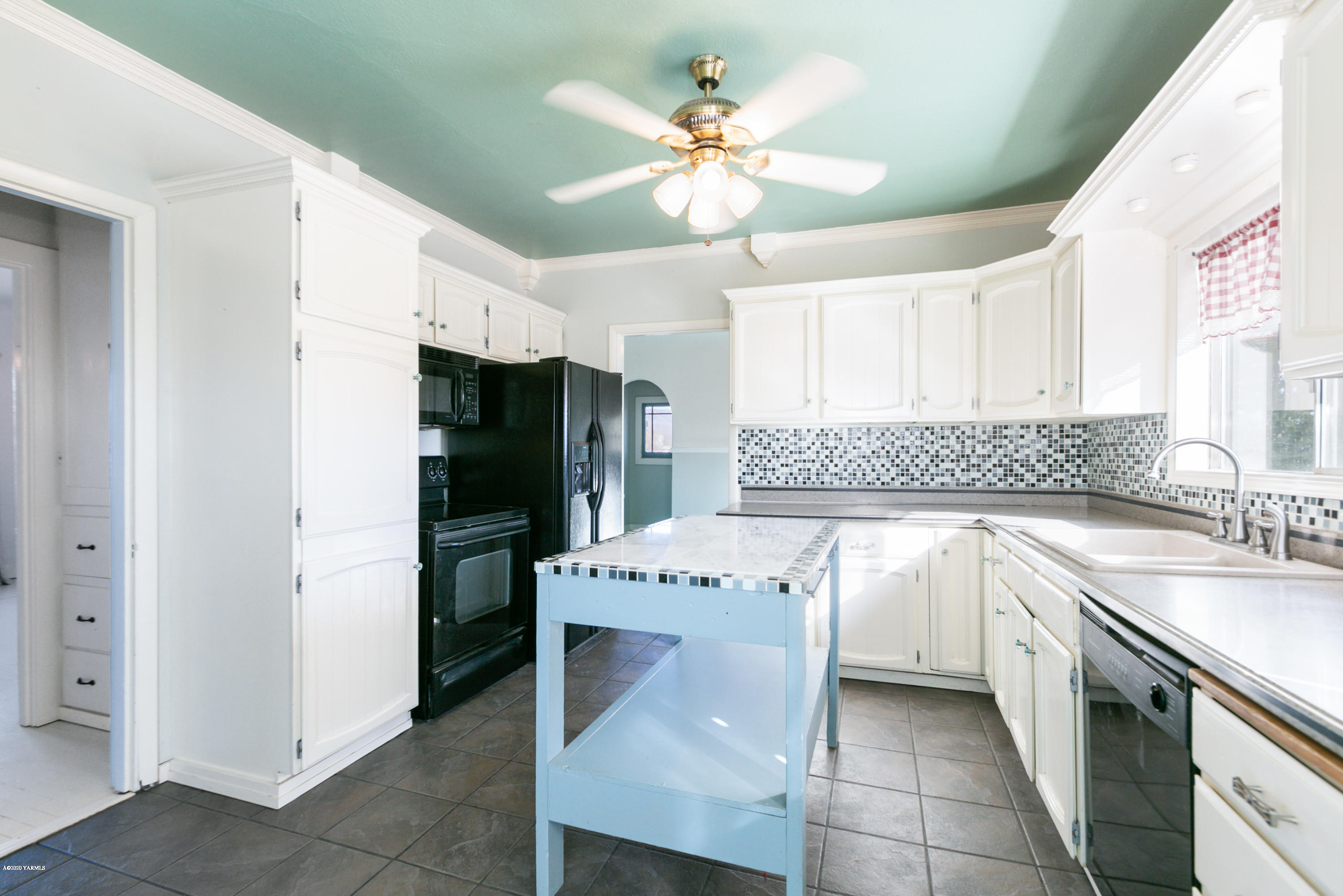 780 Elliott Road Cowiche, WA 98923 - Photo 2 of 18 a kitchen with stainless steel appliances granite countertop a refrigerator a sink dishwasher a stove with white cabinets