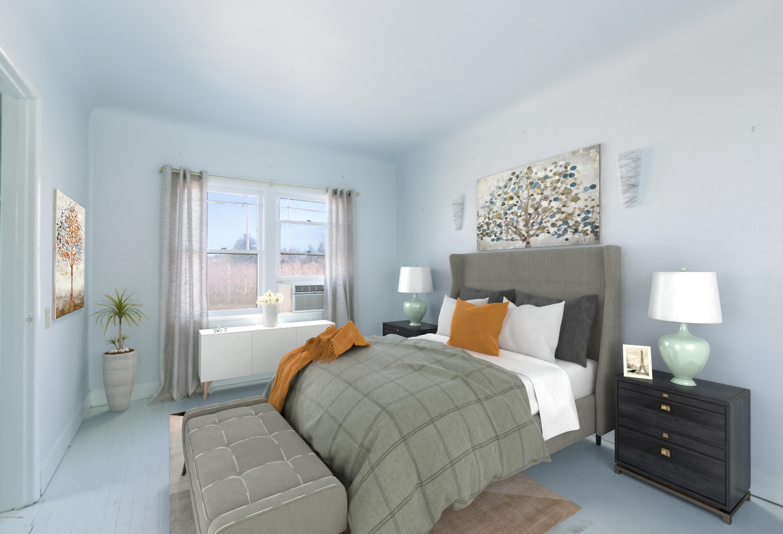 780 Elliott Road Cowiche, WA 98923 - Photo 9 of 18 a bedroom with a bed and a lamp