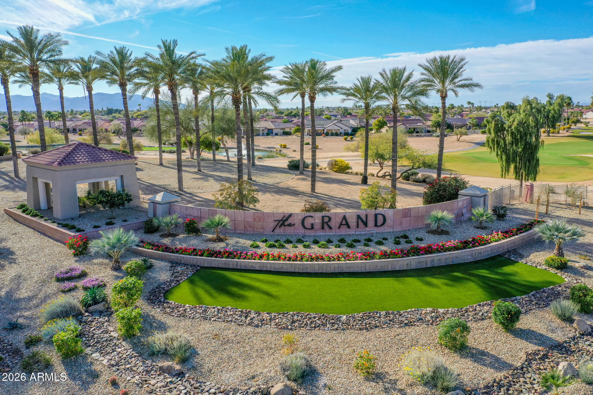 19760 North Los Altos Way Surprise, AZ 85374 - Photo 20 of 53 a view of a backyard with a garden and swimming pool