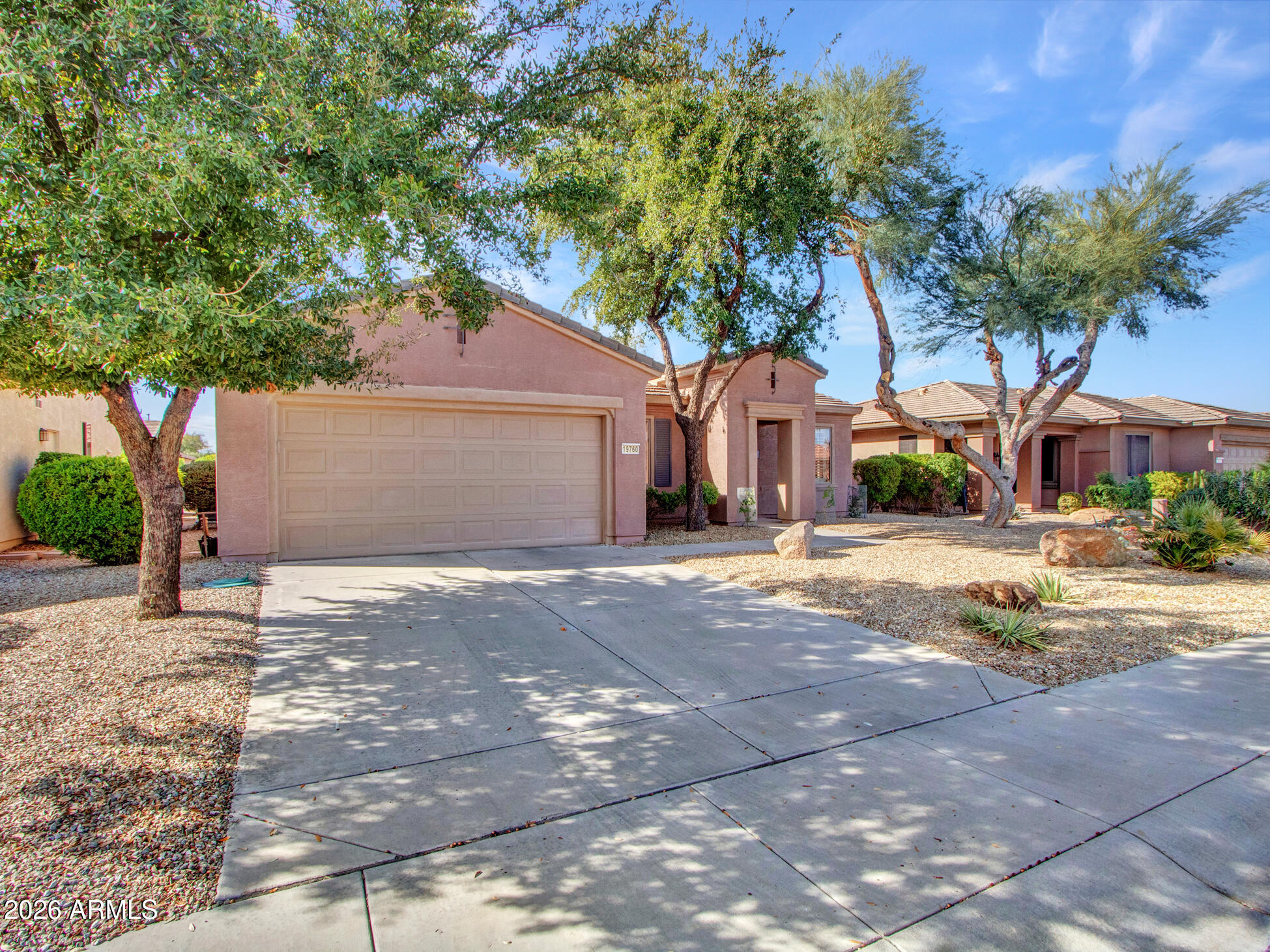 19760 North Los Altos Way Surprise, AZ 85374 - Photo 29 of 53 a front view of a house with a yard and garage