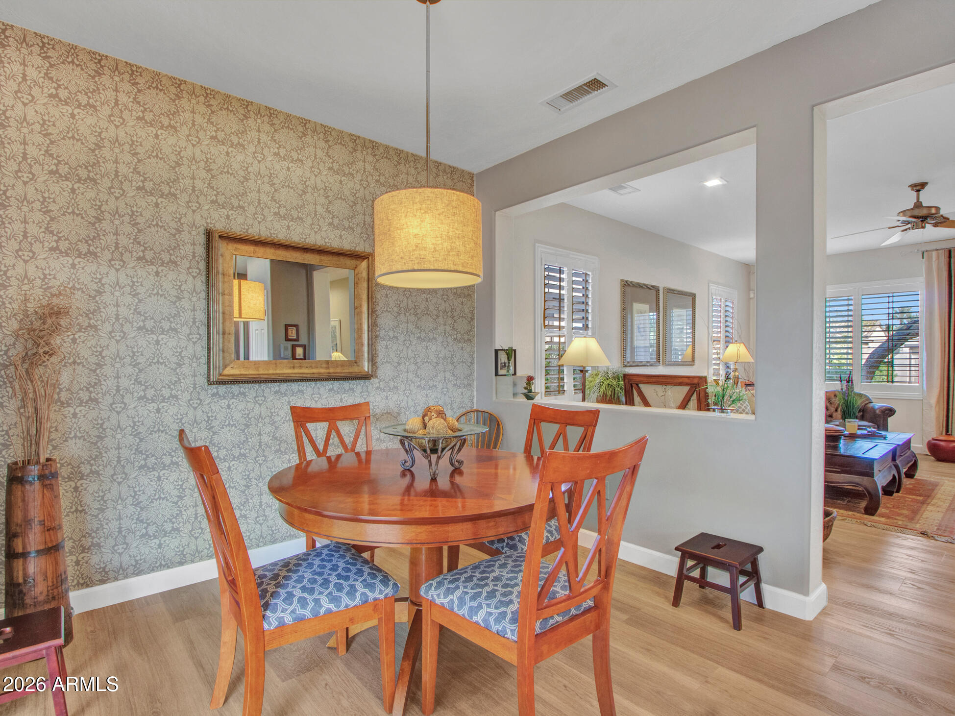 19760 North Los Altos Way Surprise, AZ 85374 - Photo 33 of 53 a view of a dining room with furniture and wooden floor