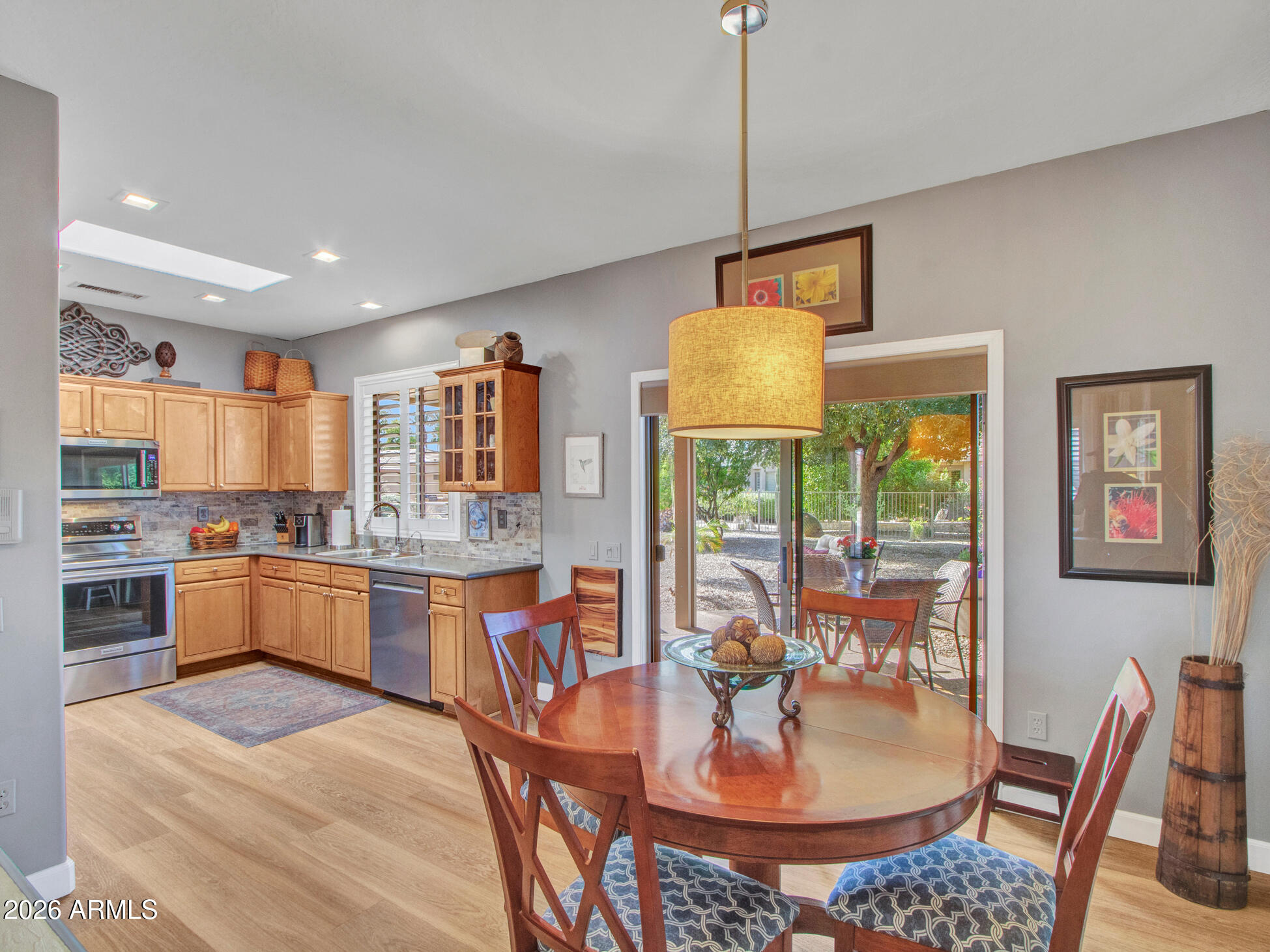 19760 North Los Altos Way Surprise, AZ 85374 - Photo 34 of 53 a large kitchen with a table and chairs