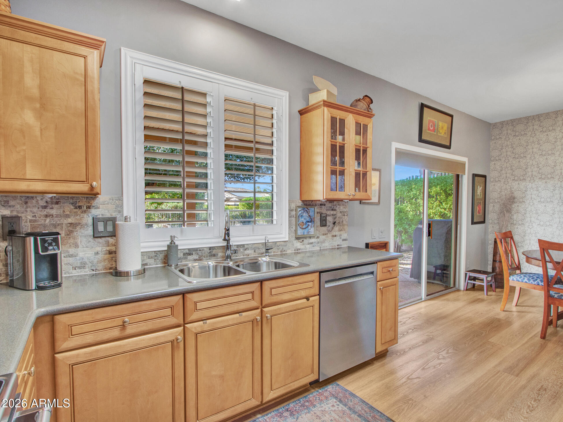 19760 North Los Altos Way Surprise, AZ 85374 - Photo 37 of 53 a kitchen with stainless steel appliances granite countertop a stove a sink and a microwave