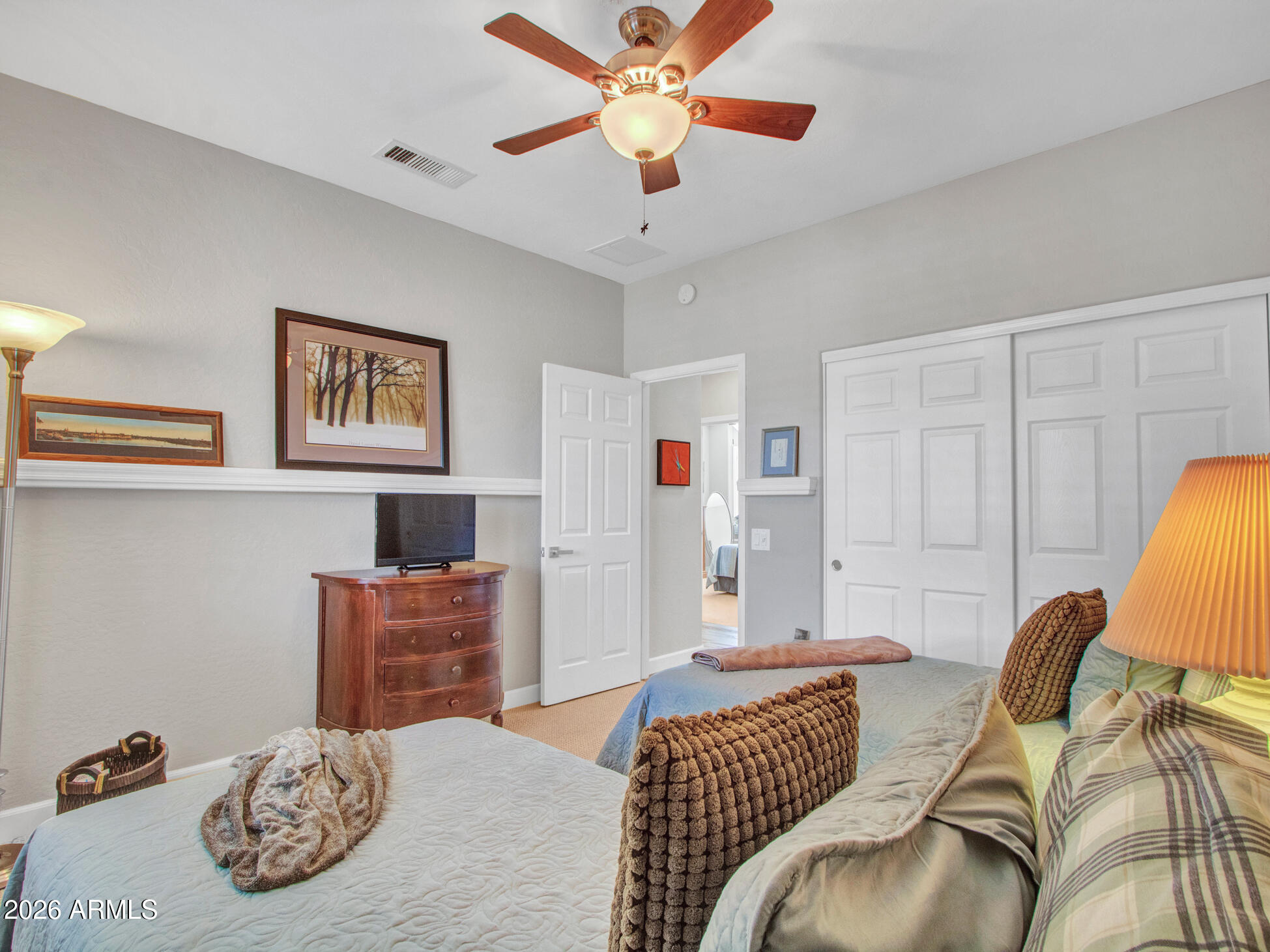 19760 North Los Altos Way Surprise, AZ 85374 - Photo 42 of 53 a bedroom with furniture and a bed