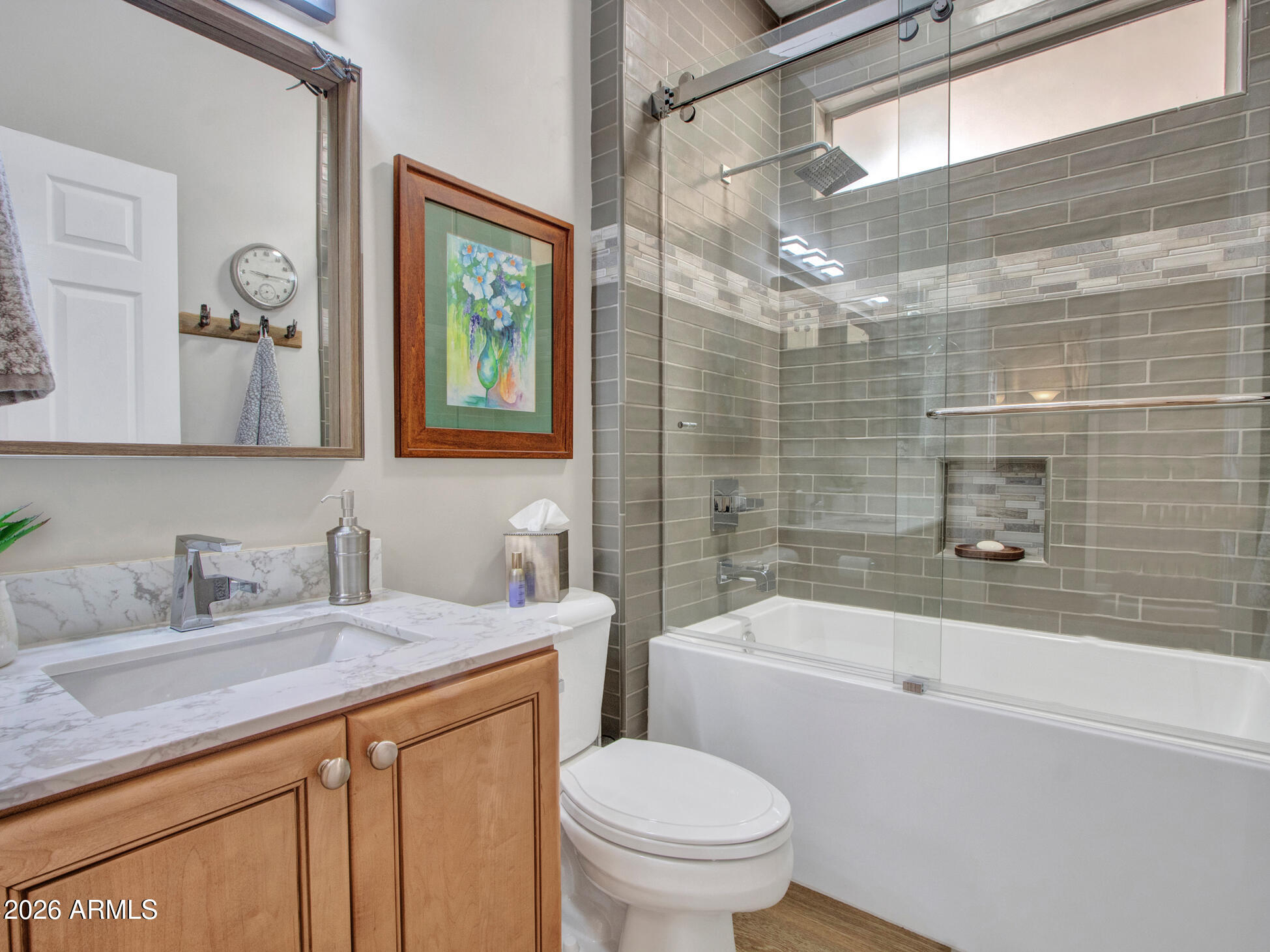 19760 North Los Altos Way Surprise, AZ 85374 - Photo 43 of 53 a bathroom with a sink a toilet and shower