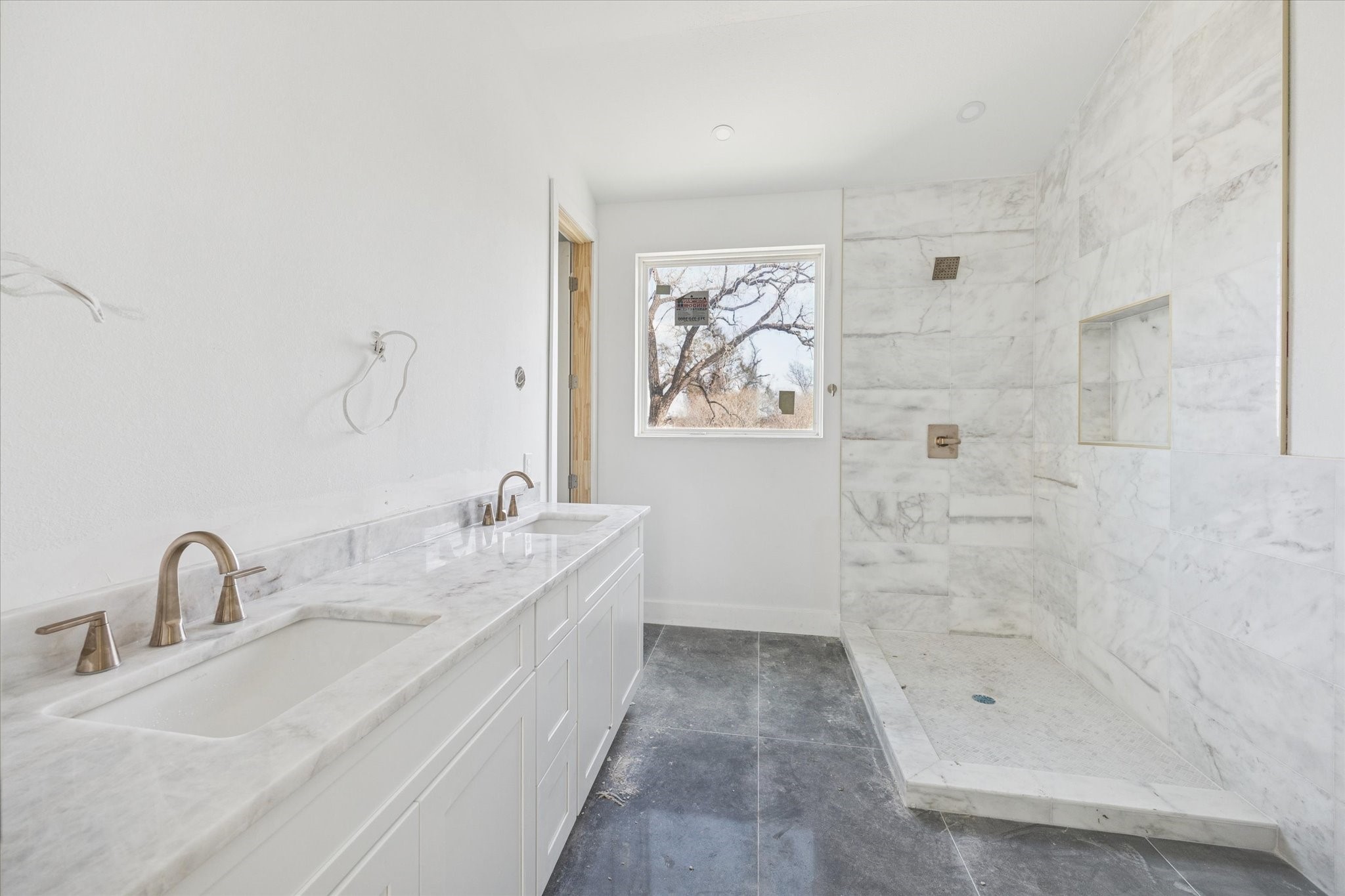 1032 West 17th Street, Unit A Houston, TX 77008 - Photo 7 of 21 a bathroom with a double vanity sink toilet and shower