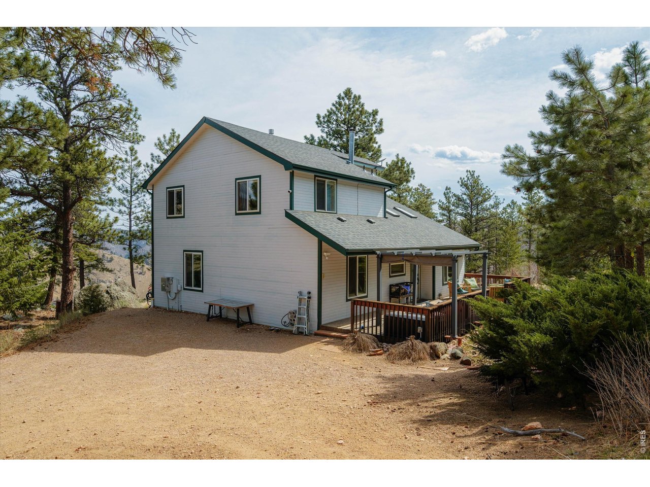 842 Unger Mountain Road Bellvue, CO 80512 - Photo 1 of 45 a view of a house with a yard