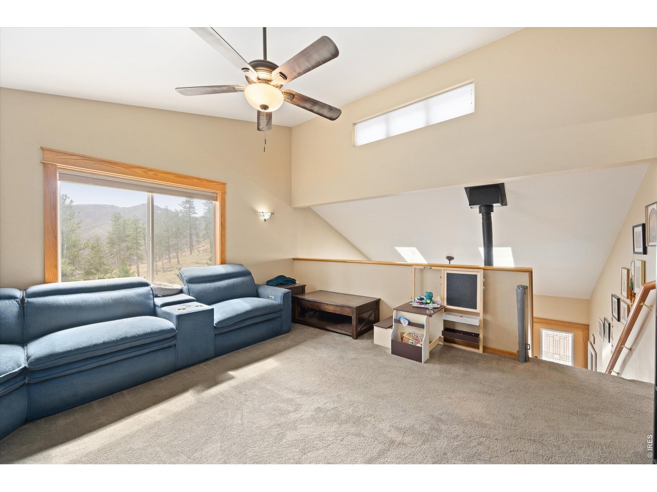 842 Unger Mountain Road Bellvue, CO 80512 - Photo 18 of 45 a living room with furniture and a large window
