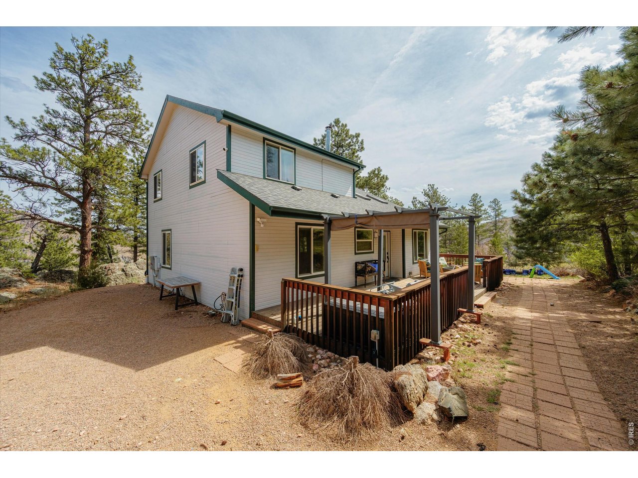 842 Unger Mountain Road Bellvue, CO 80512 - Photo 2 of 45 a view of a house with wooden fence