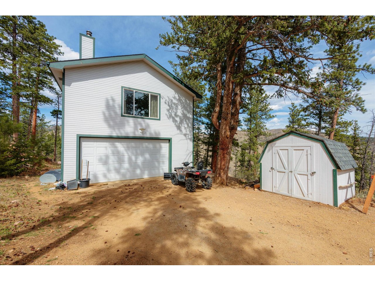842 Unger Mountain Road Bellvue, CO 80512 - Photo 21 of 45 a view of a house with a yard
