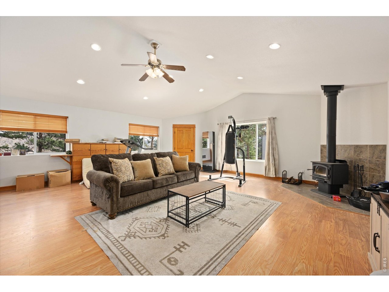 842 Unger Mountain Road Bellvue, CO 80512 - Photo 24 of 45 a living room with furniture and a flat screen tv