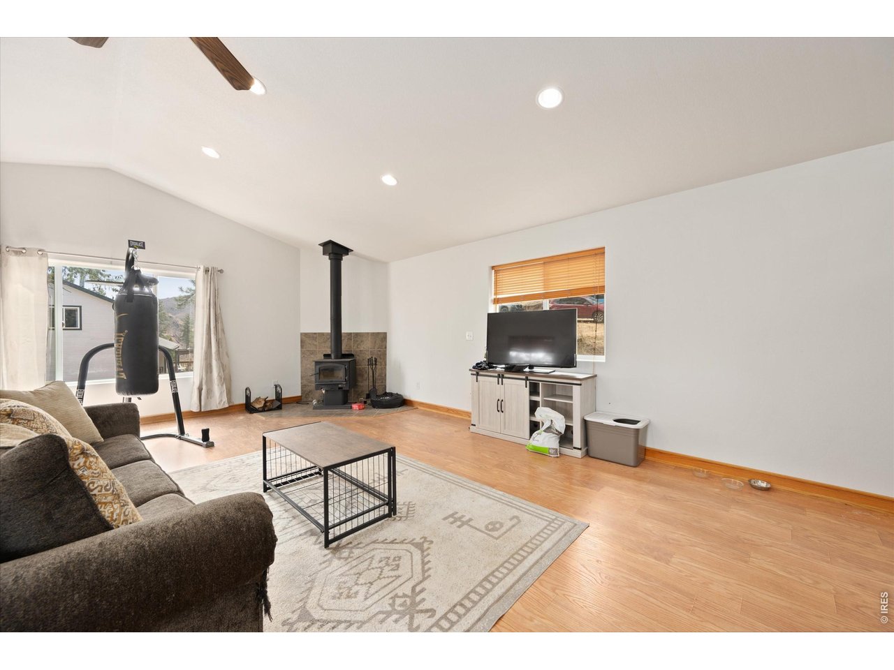 842 Unger Mountain Road Bellvue, CO 80512 - Photo 26 of 45 a living room with furniture and a flat screen tv