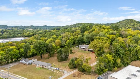 a view of a lake with houses in the back