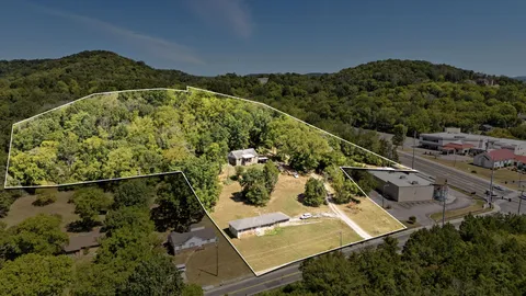 an aerial view of a residential houses and outdoor space