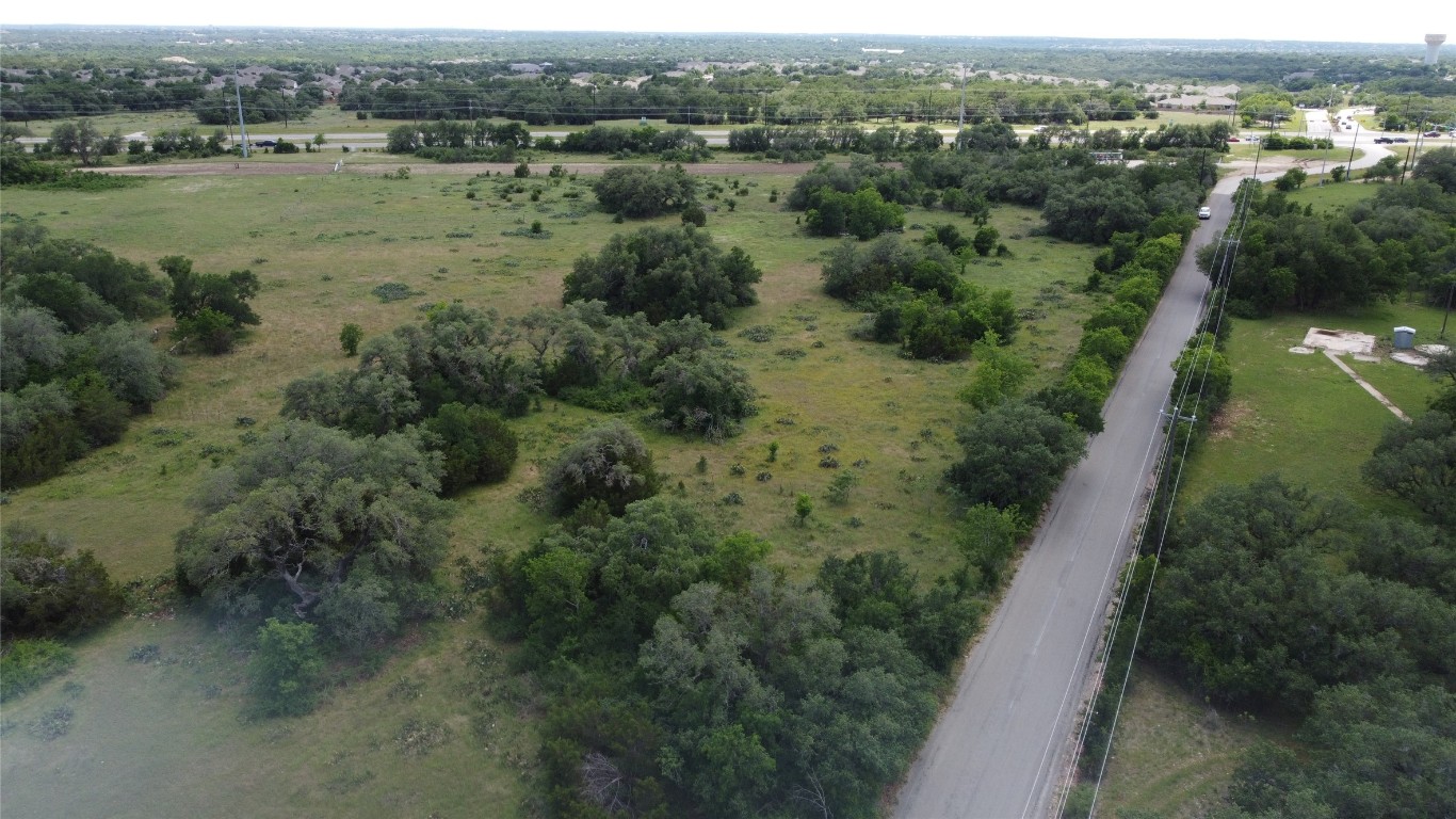 371-561 County Road 147 Georgetown, TX 78633 - Photo 6 of 9 an aerial view of green landscape with trees all around