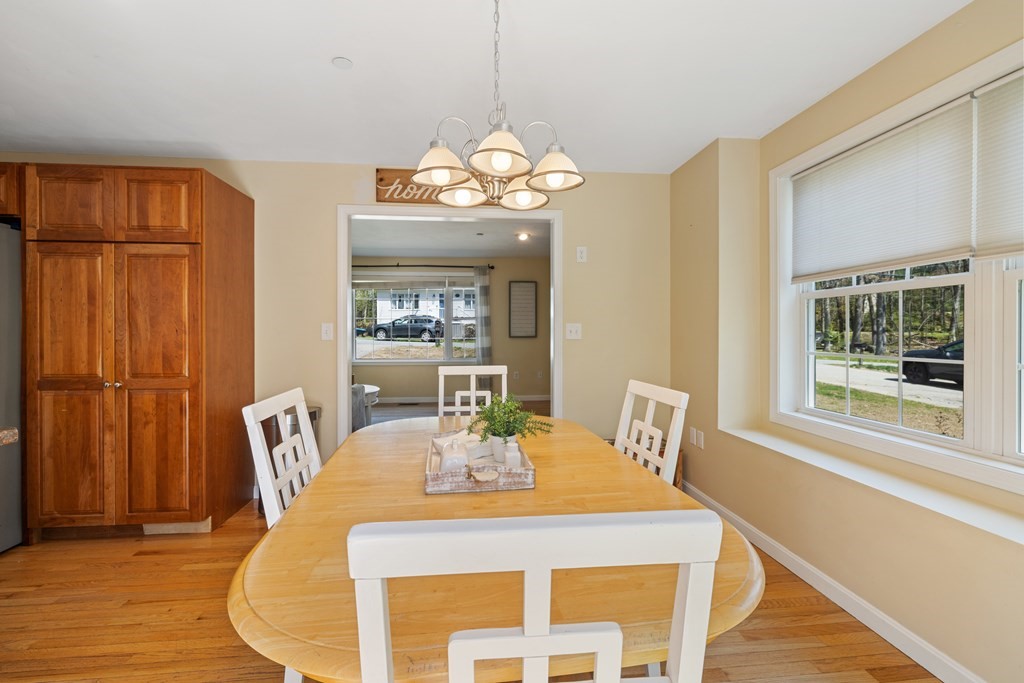 9 Evergreen Road Salem, NH 03079 - Photo 11 of 41 a view of a dining room with furniture wooden floor and chandelier