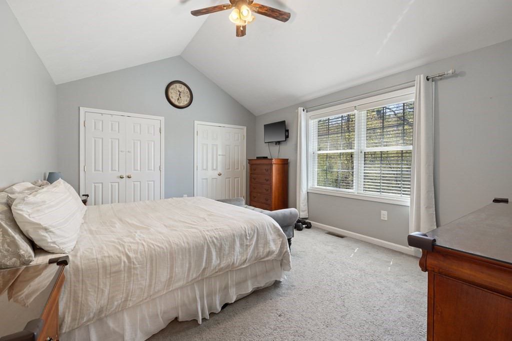 9 Evergreen Road Salem, NH 03079 - Photo 16 of 41 a bedroom with a bed and a window