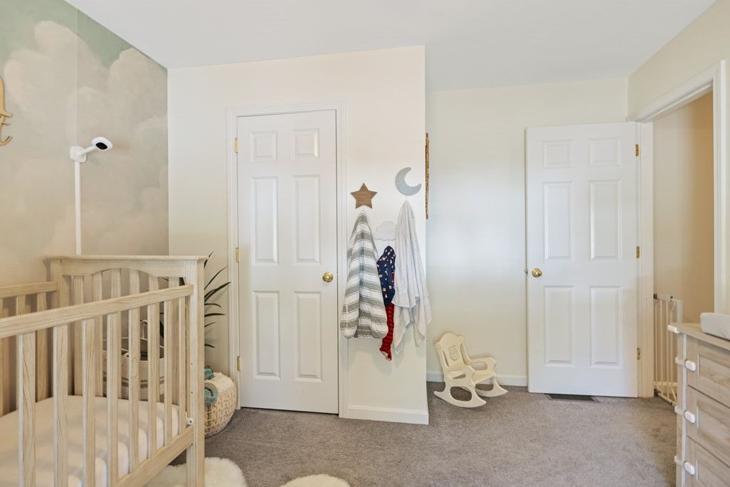 9 Evergreen Road Salem, NH 03079 - Photo 22 of 41 a view of a bedroom with baby crib