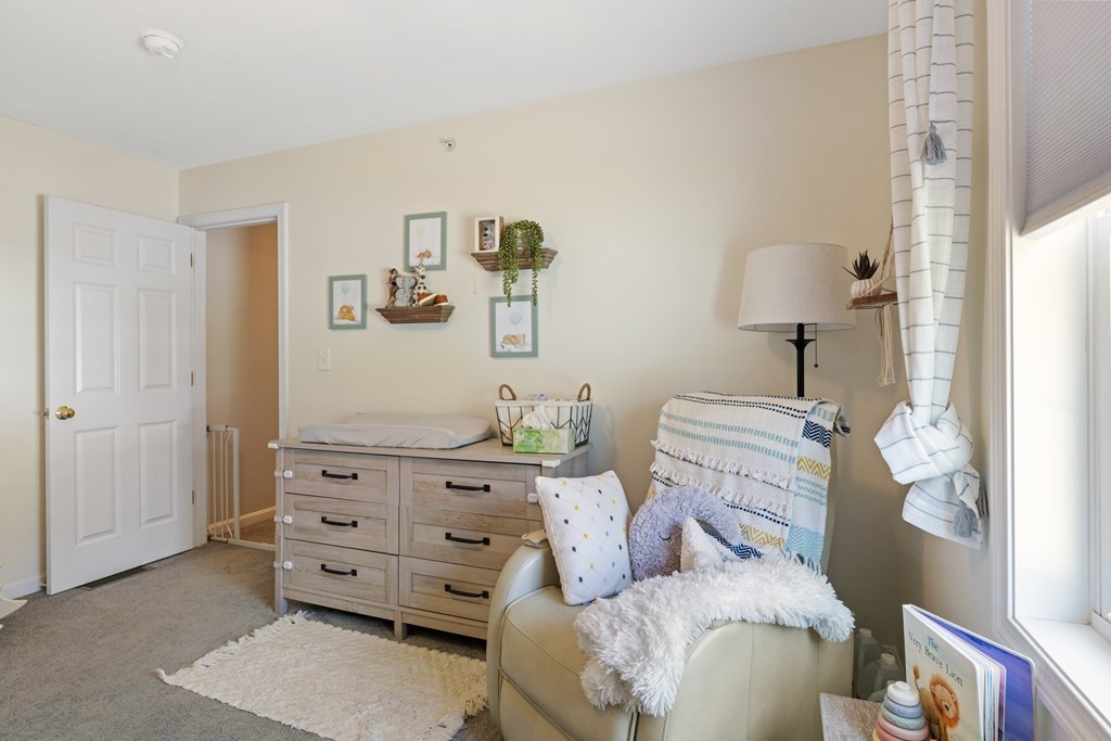 9 Evergreen Road Salem, NH 03079 - Photo 23 of 41 a living room with furniture and a dresser