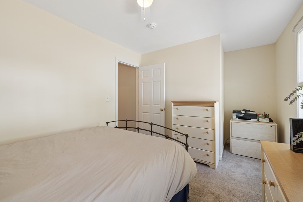 9 Evergreen Road Salem, NH 03079 - Photo 25 of 41 a bedroom with a bed and a desk