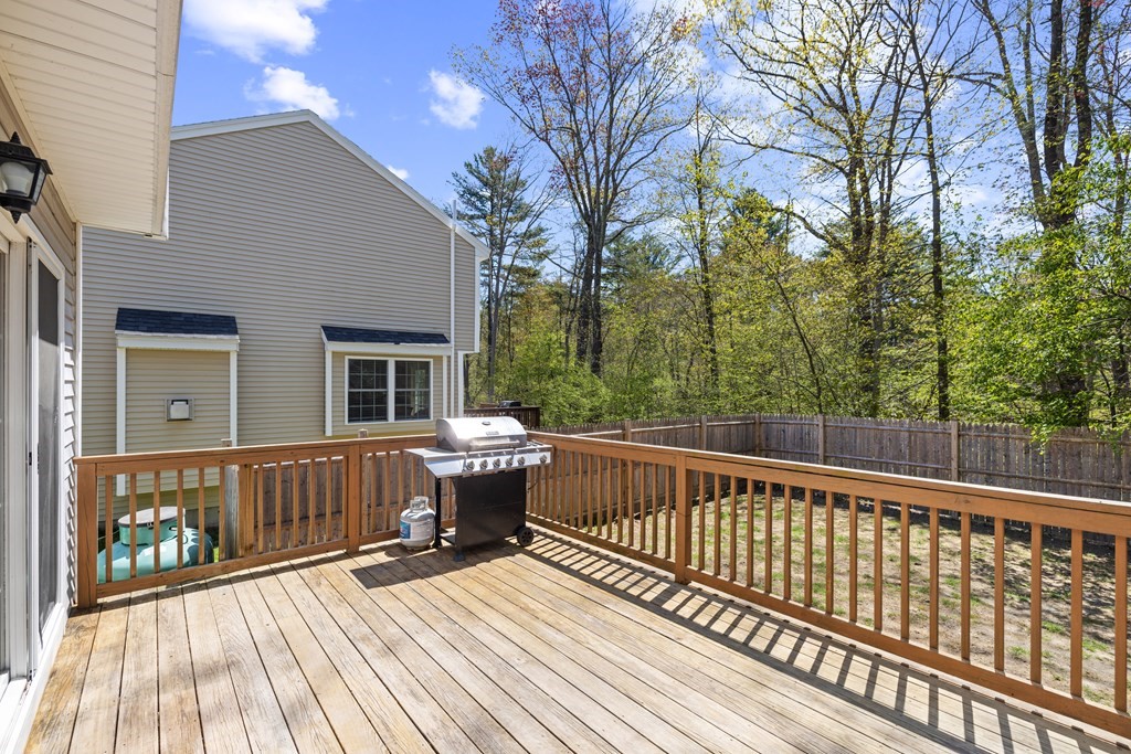 9 Evergreen Road Salem, NH 03079 - Photo 33 of 41 a view of balcony with wooden floor and fence