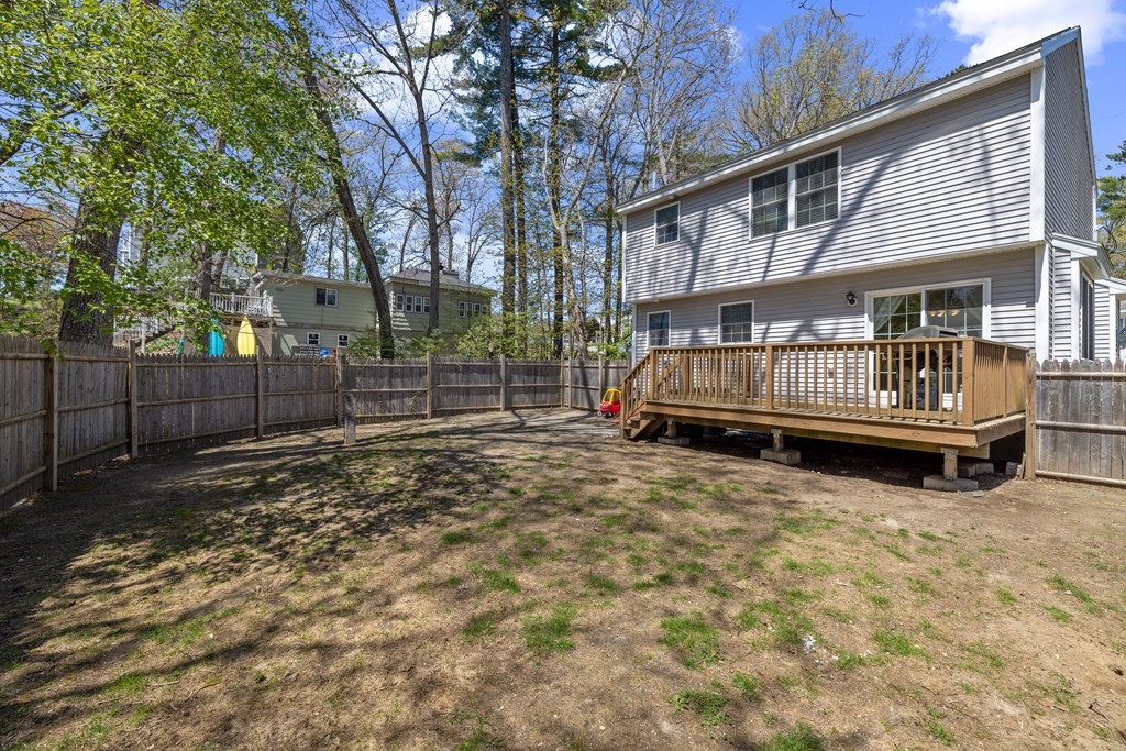 9 Evergreen Road Salem, NH 03079 - Photo 40 of 41 a view of backyard with wooden fence and a large tree