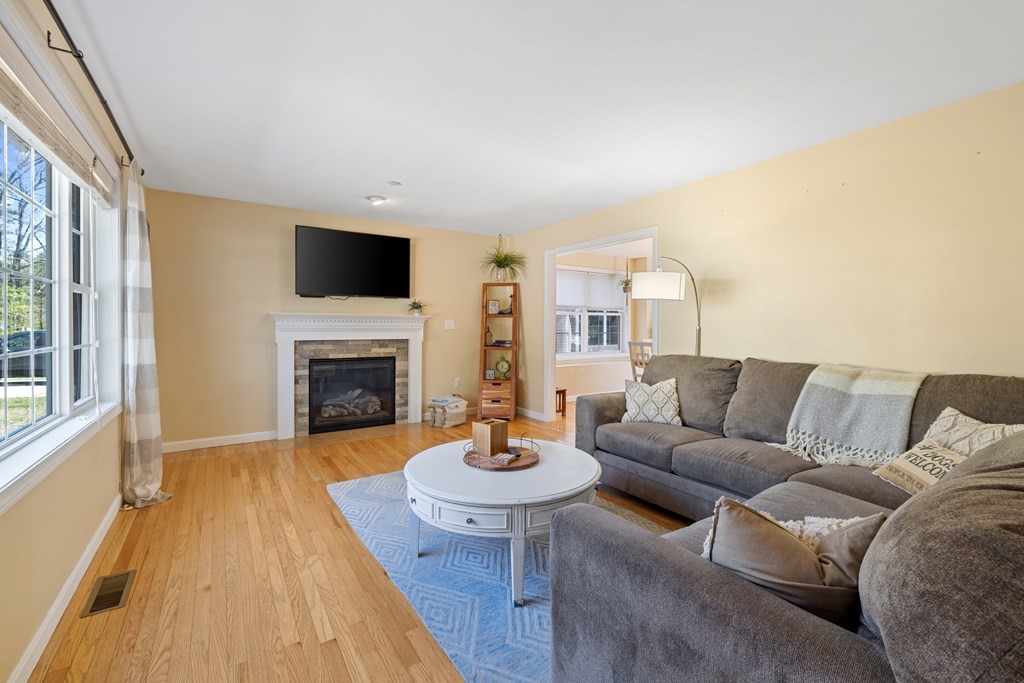 9 Evergreen Road Salem, NH 03079 - Photo 4 of 41 a living room with furniture and a fireplace