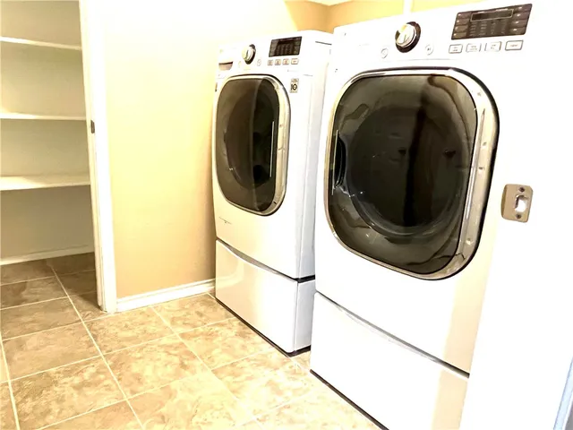 a utility room with dryer and washer