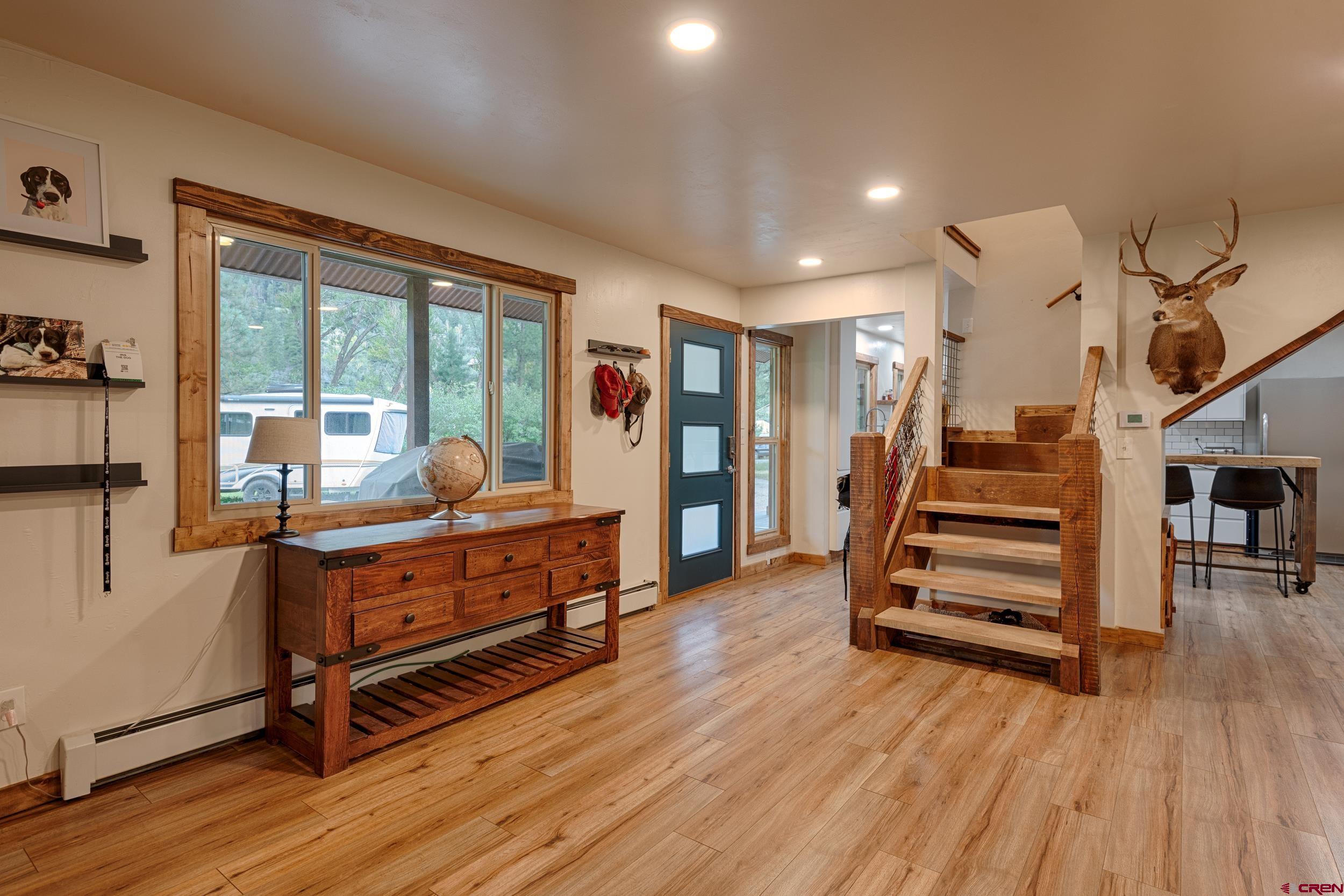 559 Suzanne Lane Ridgway, CO 81432 - Photo 12 of 45 a room with lots of wooden furniture and a wooden floor