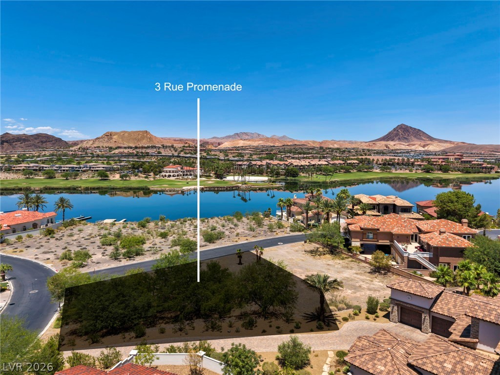 3 Rue Promenade Way Henderson, NV 89011 - Photo 1 of 26 Secure a vacant lot in a gated community, offering prime views of the golf course, lake, and distant mountains.