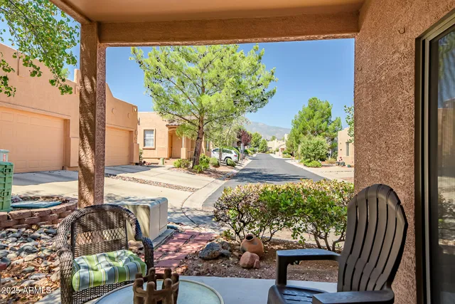 a view of a backyard with sitting area