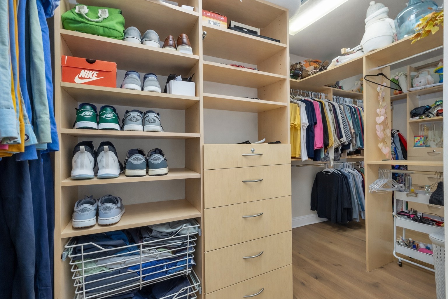 10004 Summer Ridge Lane Conroe, TX 77302 - Photo 32 of 50 a view of walk in closet with clothes and shoes
