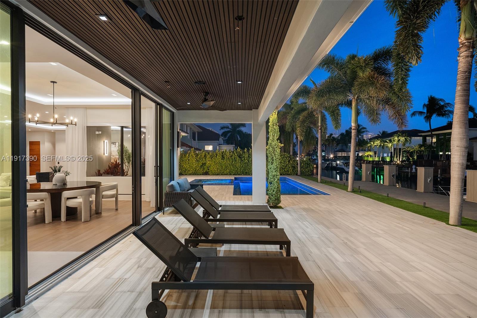 900 Washington Street Hollywood, FL 33019 - Photo 54 of 61 a swimming pool with outdoor seating and patio