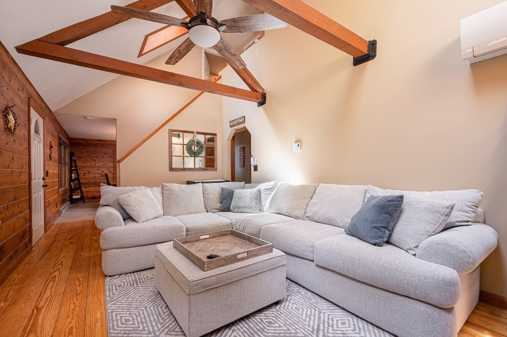 769 Mason Road Holden, MA 01522 - Photo 12 of 29 a living room with furniture a ceiling fan and a rug
