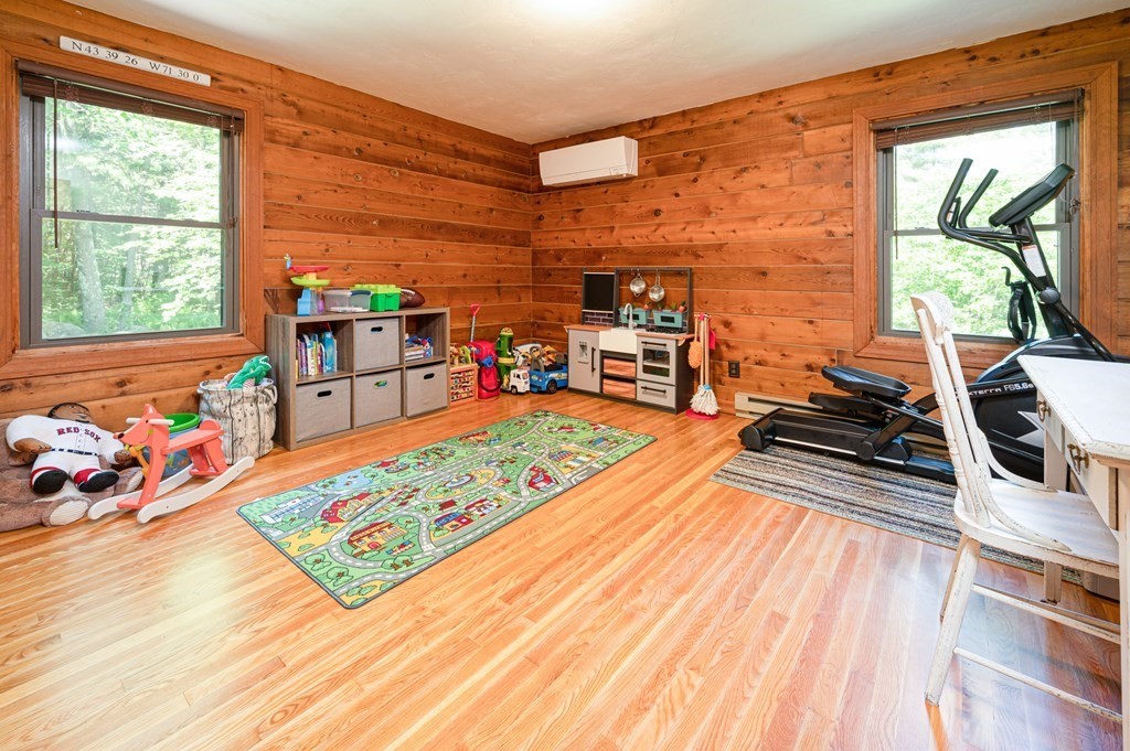 769 Mason Road Holden, MA 01522 - Photo 14 of 29 a living room with furniture a flat screen tv and next to a window
