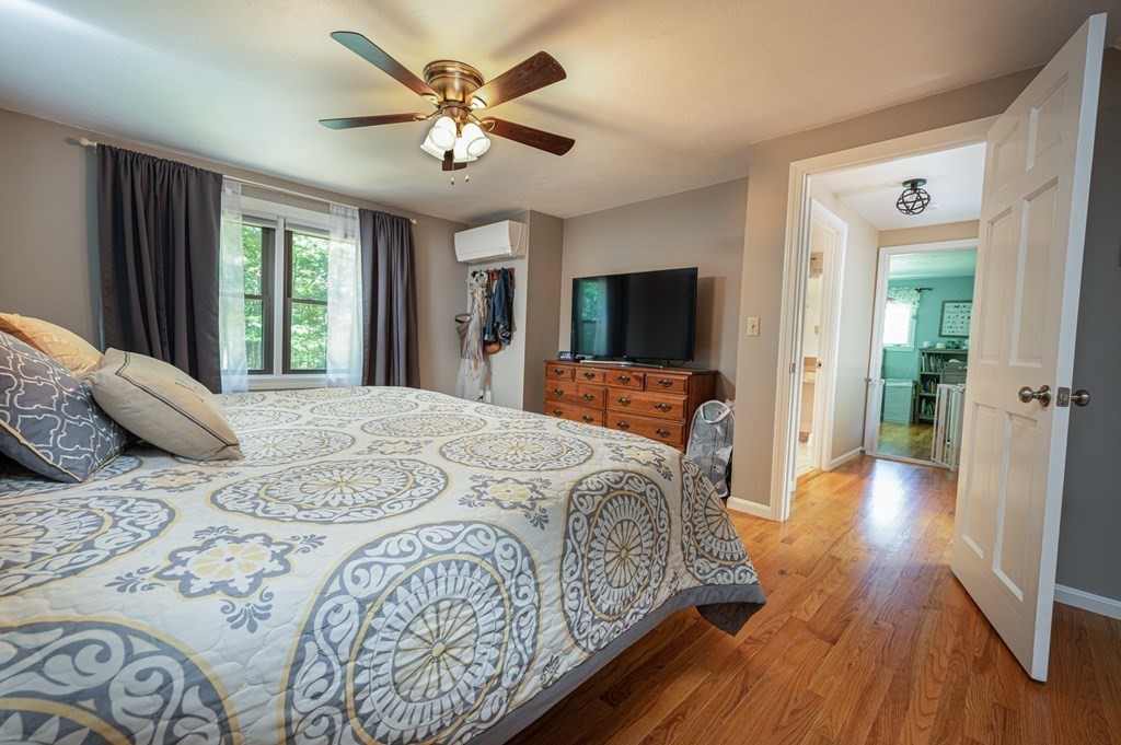769 Mason Road Holden, MA 01522 - Photo 18 of 29 a bedroom with a large bed and a tv