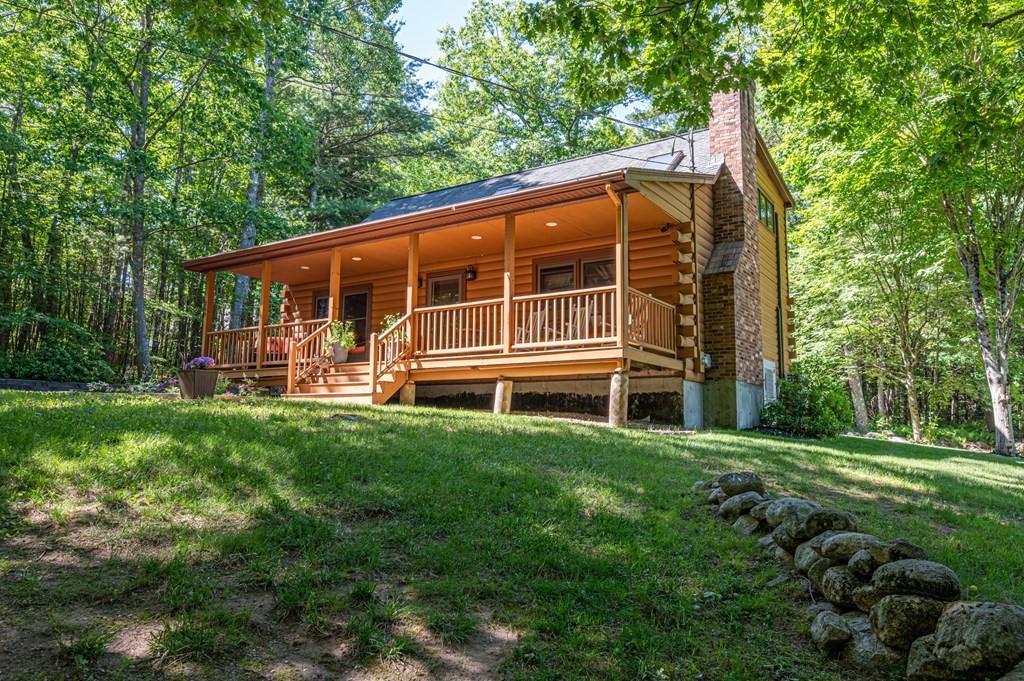 769 Mason Road Holden, MA 01522 - Photo 2 of 29 a backyard of a house with lots of green space and garden view
