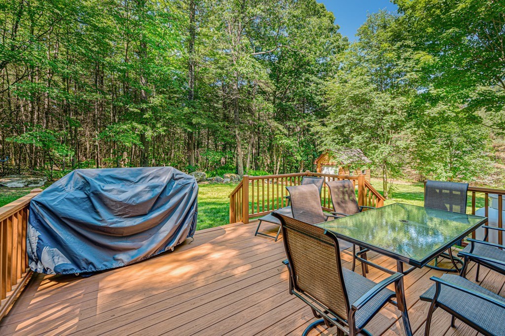 769 Mason Road Holden, MA 01522 - Photo 23 of 29 a view of a balcony with two chairs and a table